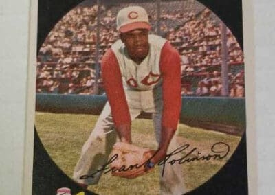 Vintage baseball card of Frank Robinson pitching, in Cincinnati Redlegs uniform, labeled with name and position.